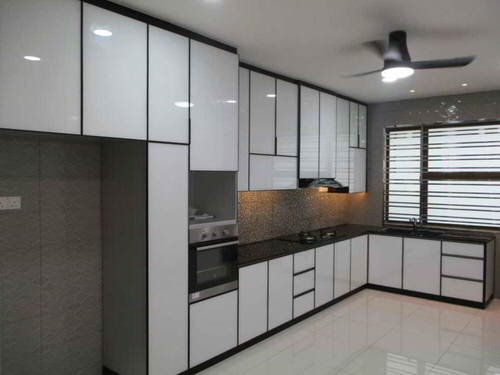 Sleek aluminium modular kitchen featuring metallic finish, modern hardware, and minimalist design for luxury apartments